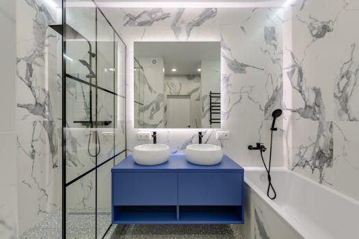 pexels-photo-11701114-11701114-2 Modern bathroom interior featuring marble walls, dual sinks, and a glass shower.